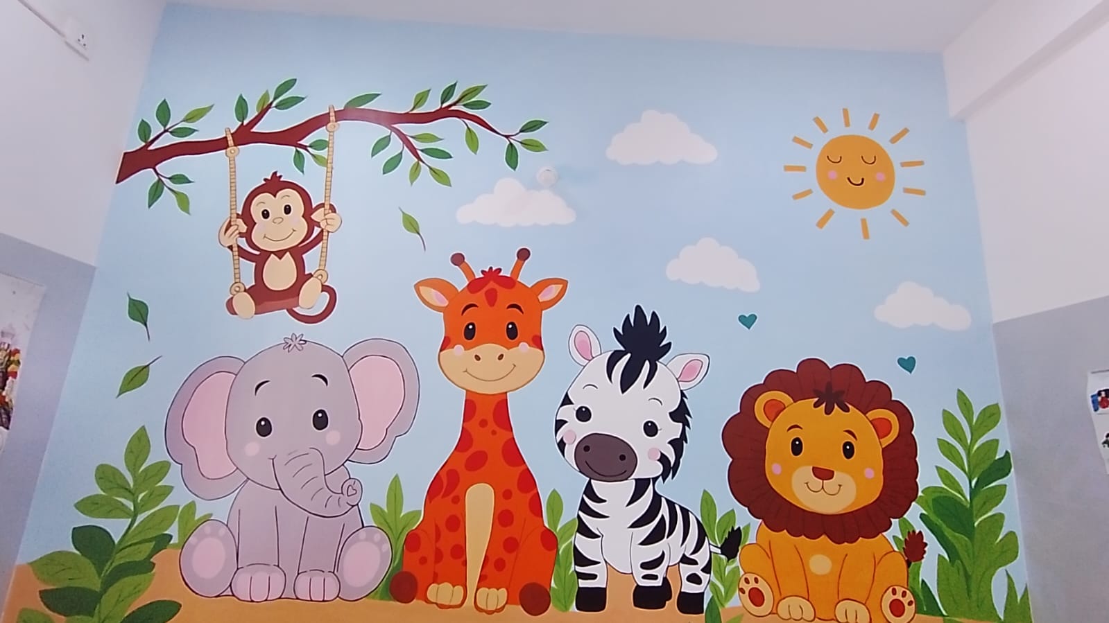 Baby animals wall mural in a doctor's consultation room