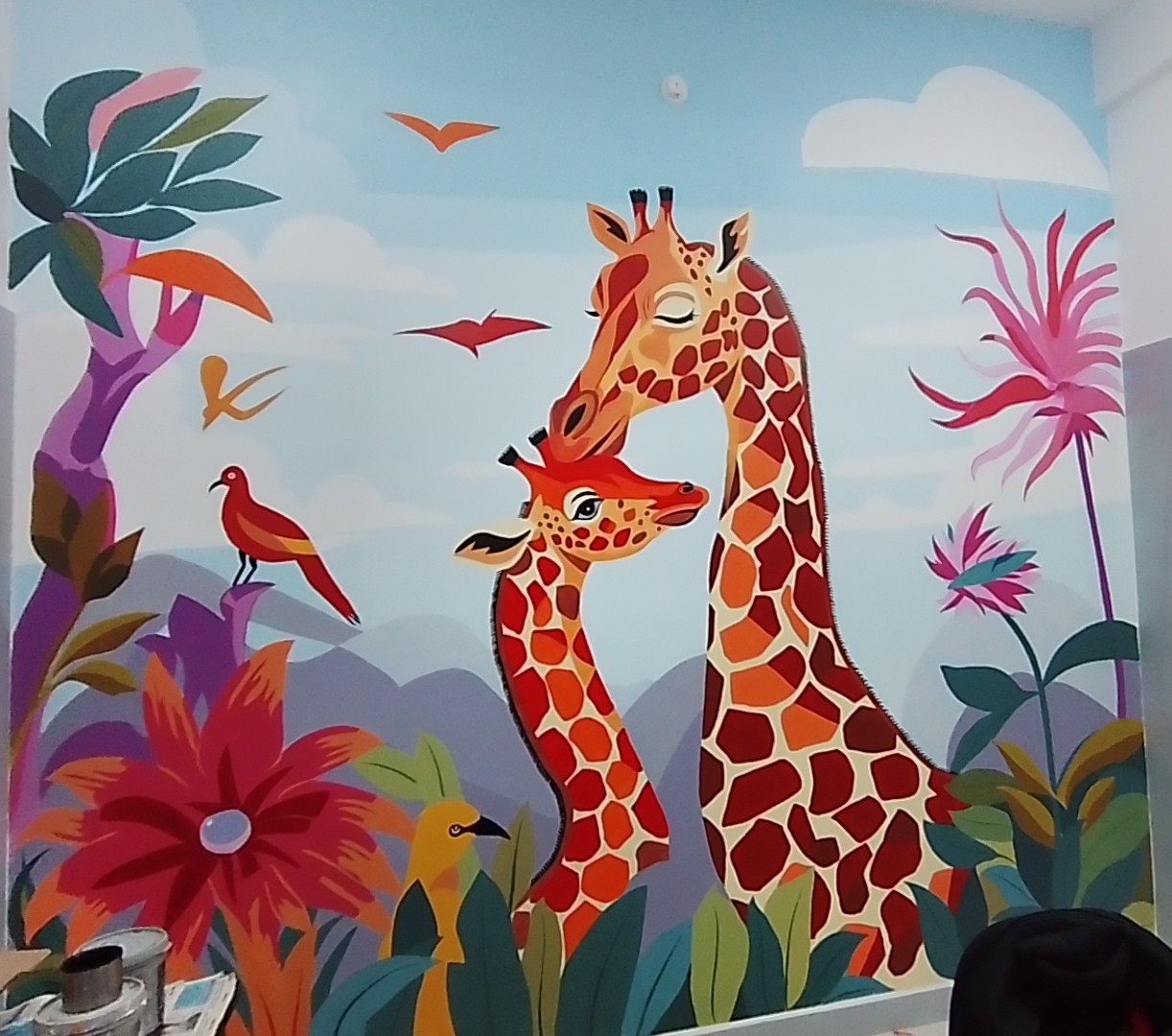 Colourful mother-and-baby giraffe mural at SISHU Neocare Hospital